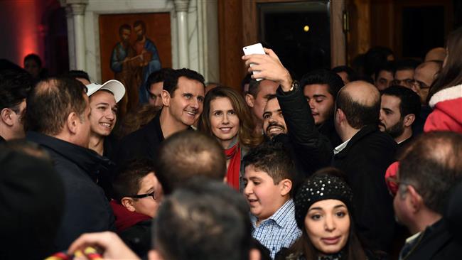 Syria's Assad visits church before Christmas / Photos